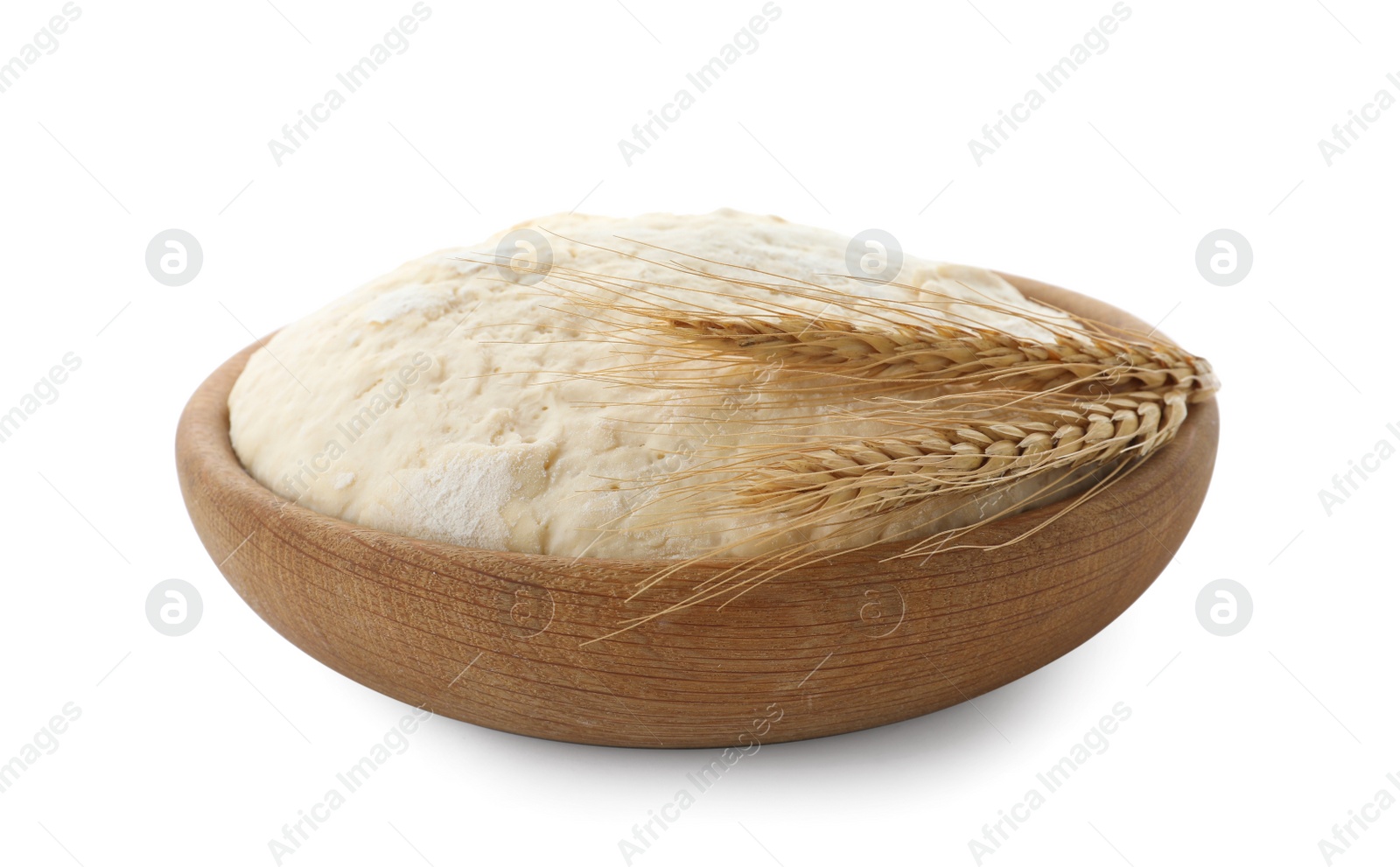 Photo of Bowl with dough for pastries and spikelets isolated on white