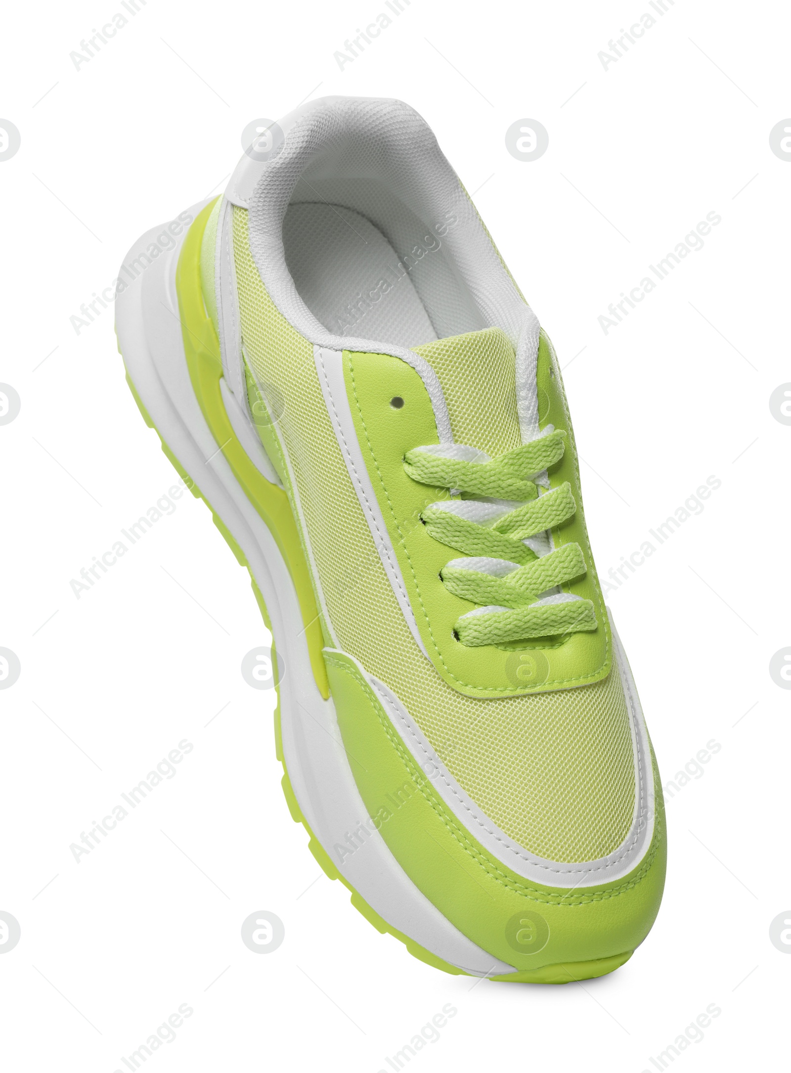 Photo of One stylish light green sneaker isolated on white