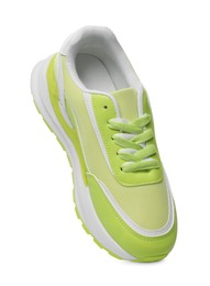 Photo of One stylish light green sneaker isolated on white