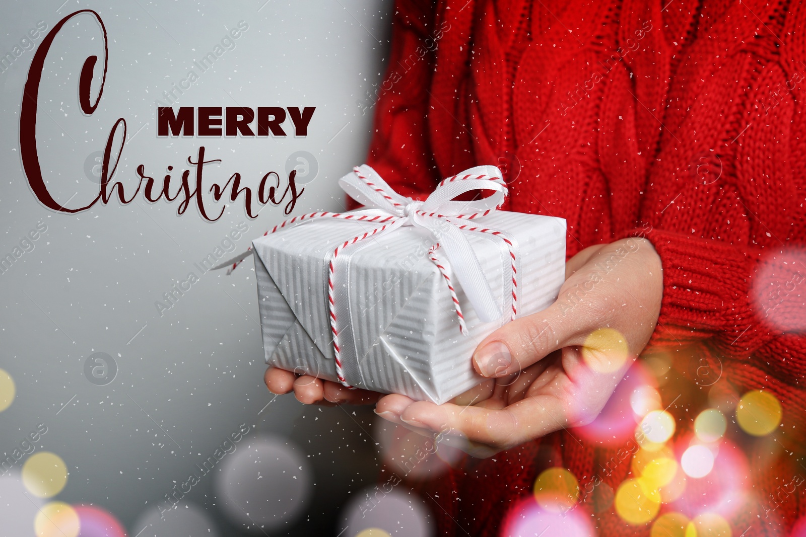 Image of Merry Christmas. Woman holding gift box on grey background, closeup