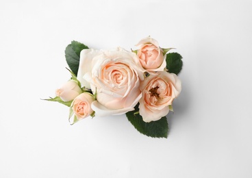 Photo of Beautiful roses on white background, top view