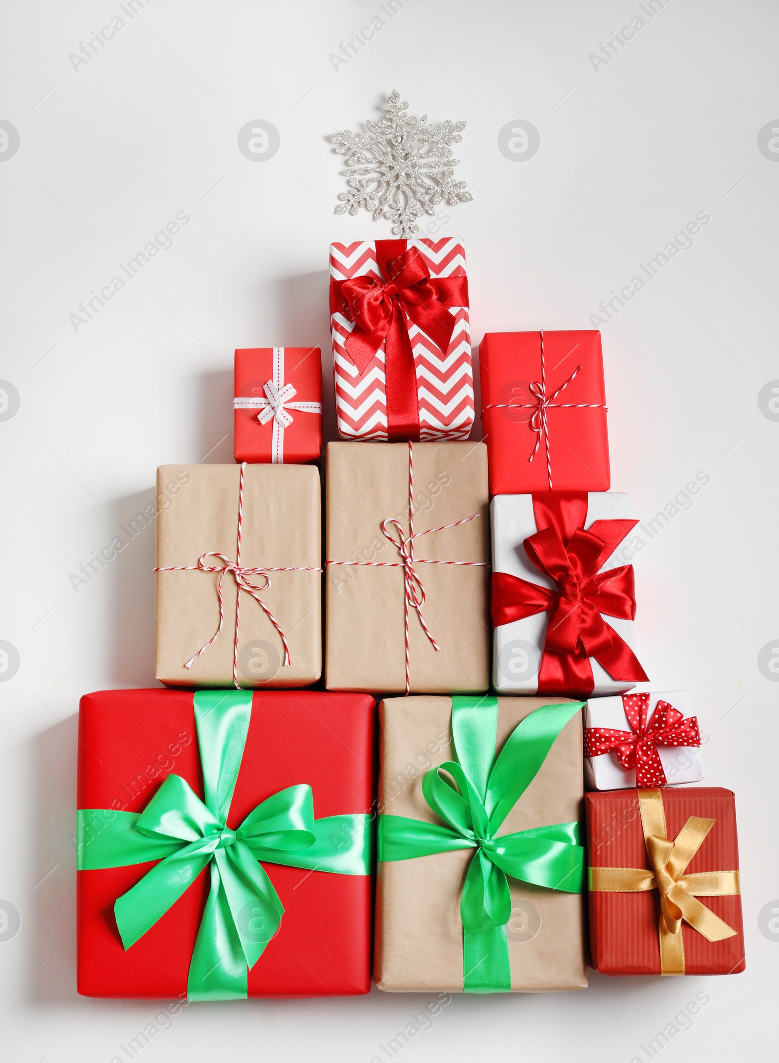 Photo of Beautifully wrapped gift boxes on white background