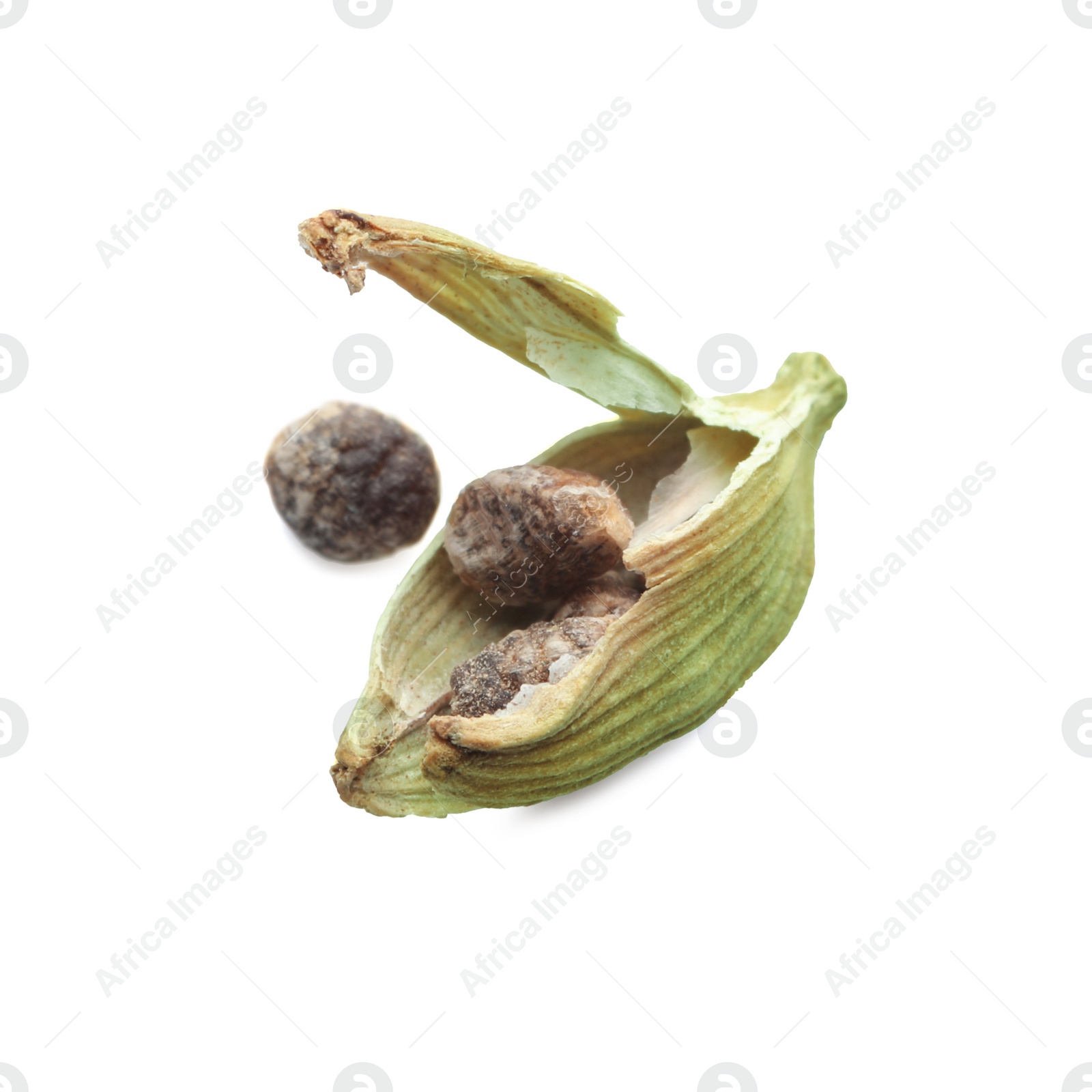 Photo of Seeds of dry green cardamom on white background