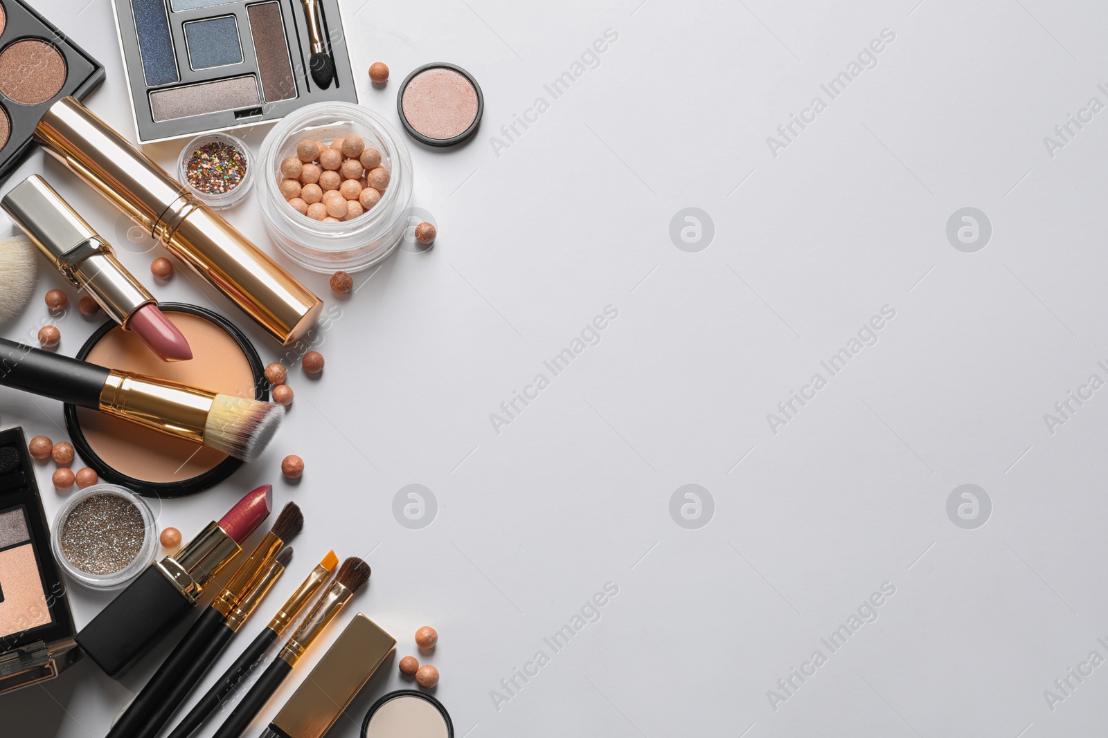 Photo of Different luxury makeup products on white background, top view