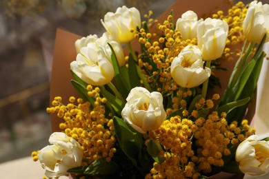 Photo of Bouquet of beautiful spring flowers near window, closeup