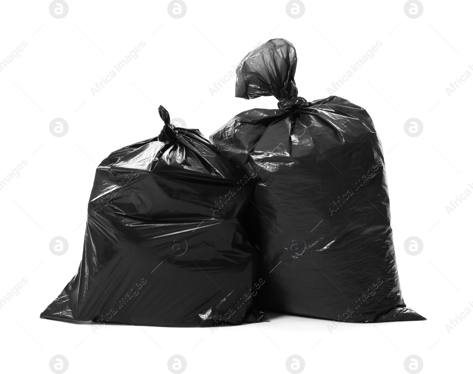 Photo of Trash bags full of garbage isolated on white