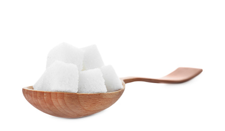 Photo of Refined sugar cubes in wooden spoon isolated on white