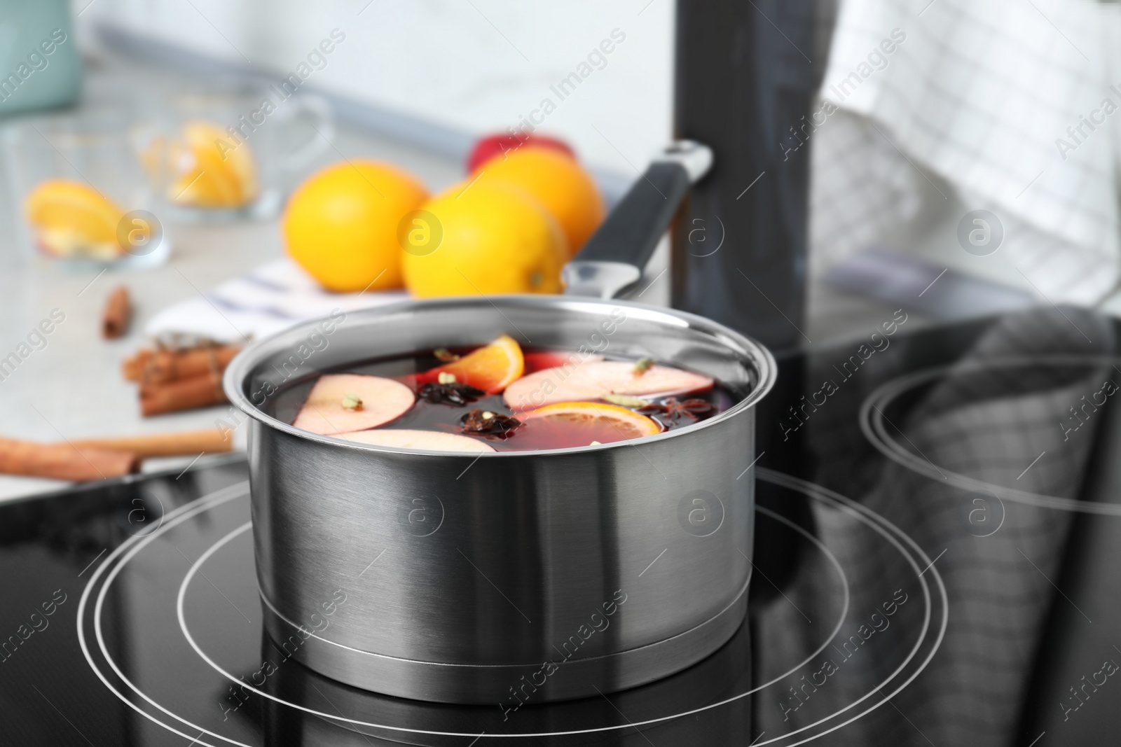 Photo of Delicious hot mulled wine in pot on stove