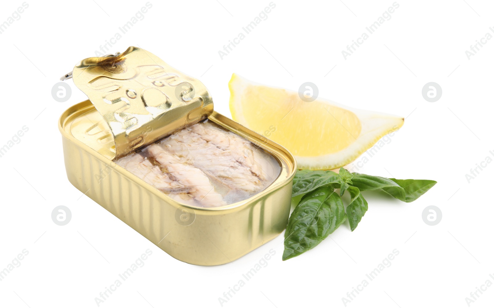 Photo of Open tin can with mackerel fillets, lemon and basil on white background