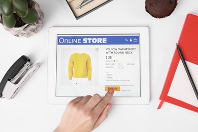 Photo of Woman with tablet shopping online on white background, top view