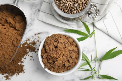 Photo of Hemp protein powder, seeds and fresh leaves on white marble table, flat lay