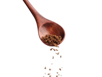 Pouring instant coffee from spoon on white background