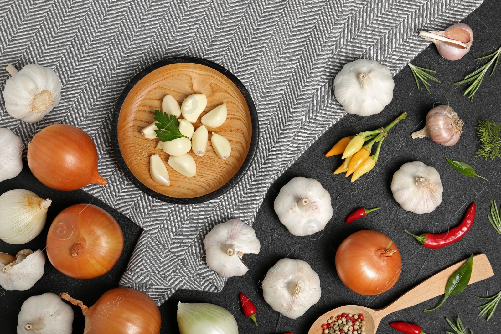 Photo of Flat lay composition with garlic and onion on table