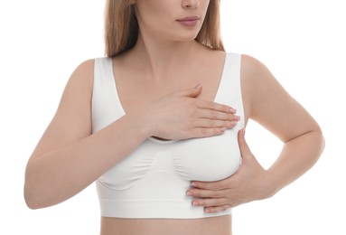 Photo of Mammology. Young woman doing breast self-examination on white background, closeup