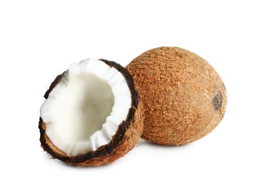 Fresh ripe brown coconuts on white background