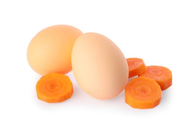 Naturally painted Easter eggs on white background. Carrot used for coloring