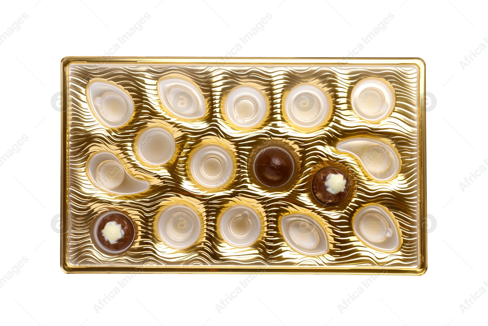 Photo of Partially empty box of chocolate candies isolated on white, top view