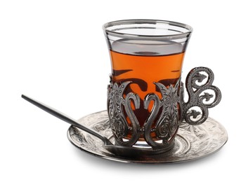 Glass of traditional Turkish tea in vintage holder isolated on white