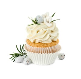 Photo of Tasty Easter cupcake with vanilla cream, candies and rosemary isolated on white