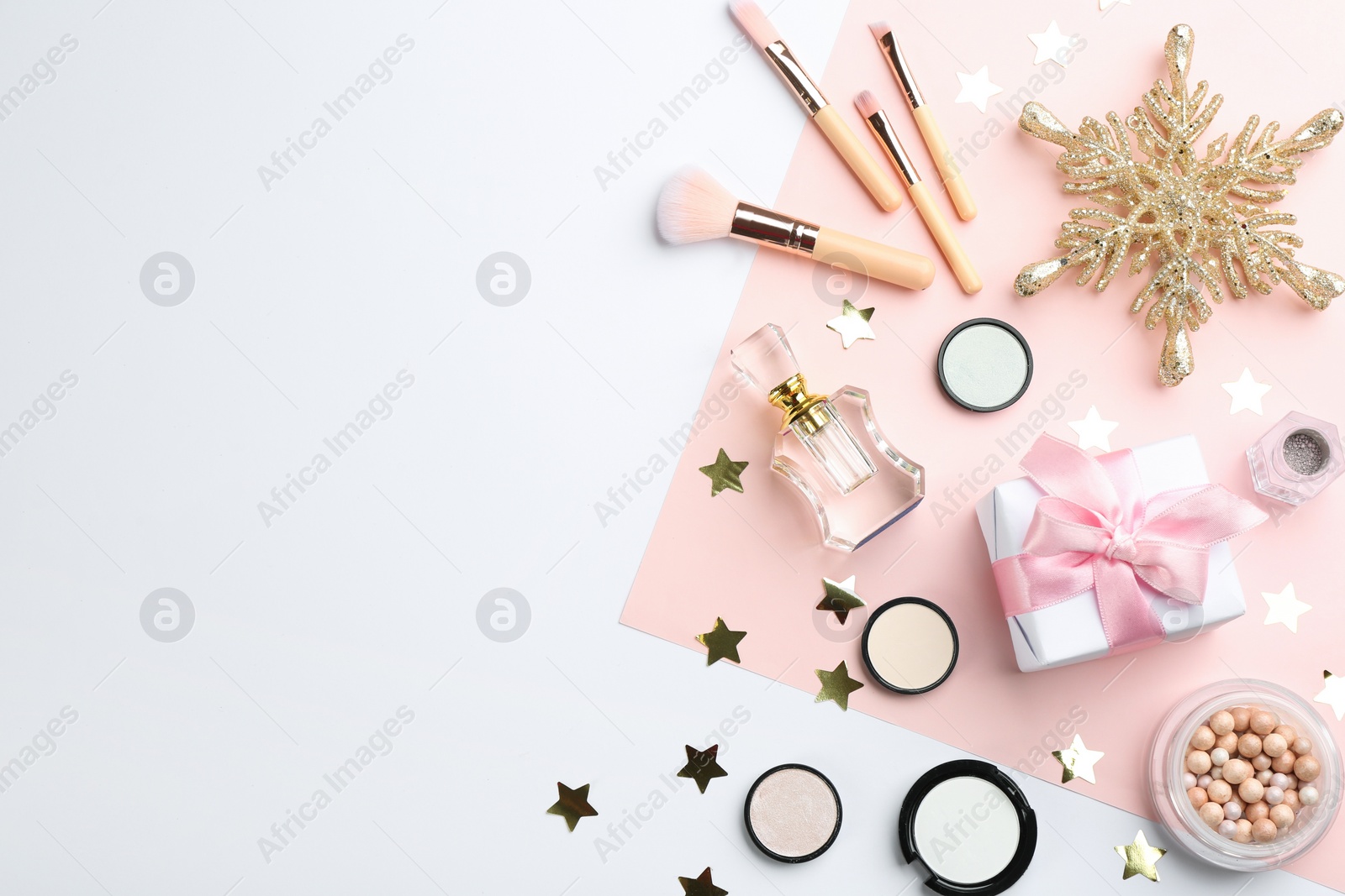 Photo of Flat lay composition with decorative cosmetic products on color background, space for text. Winter care