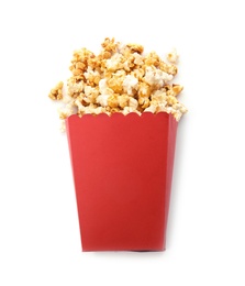 Photo of Red bucket with delicious caramel popcorn on white background