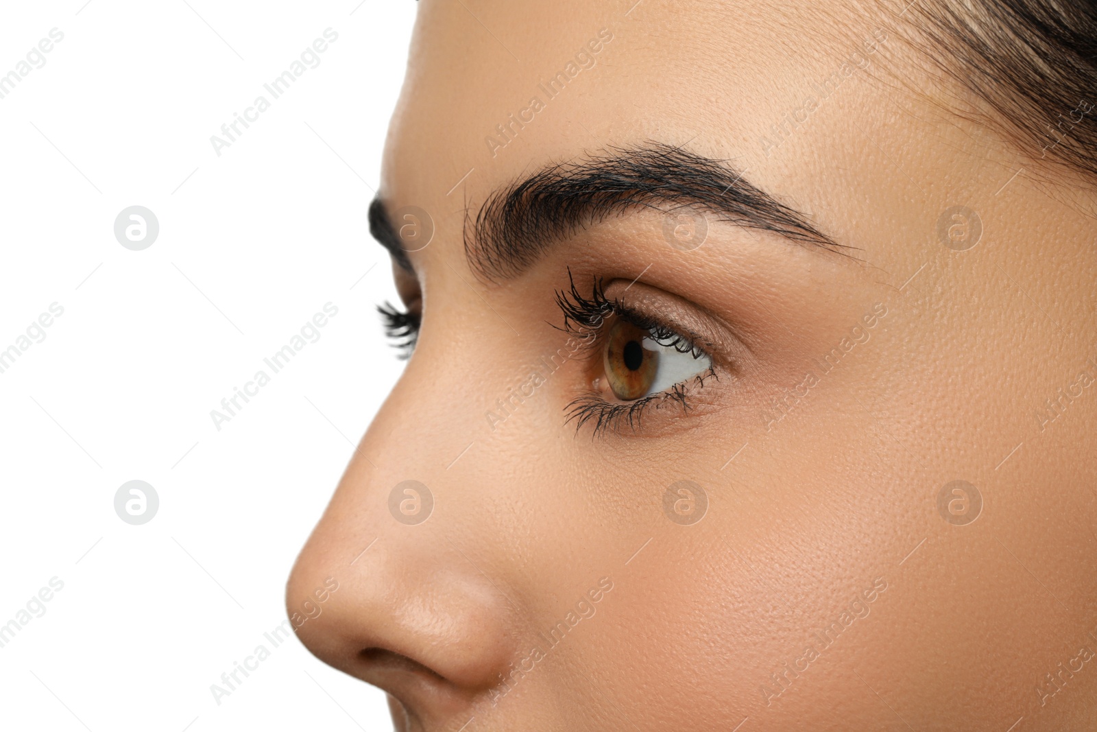 Photo of Beautiful young woman against white background, closeup. Focus on eye