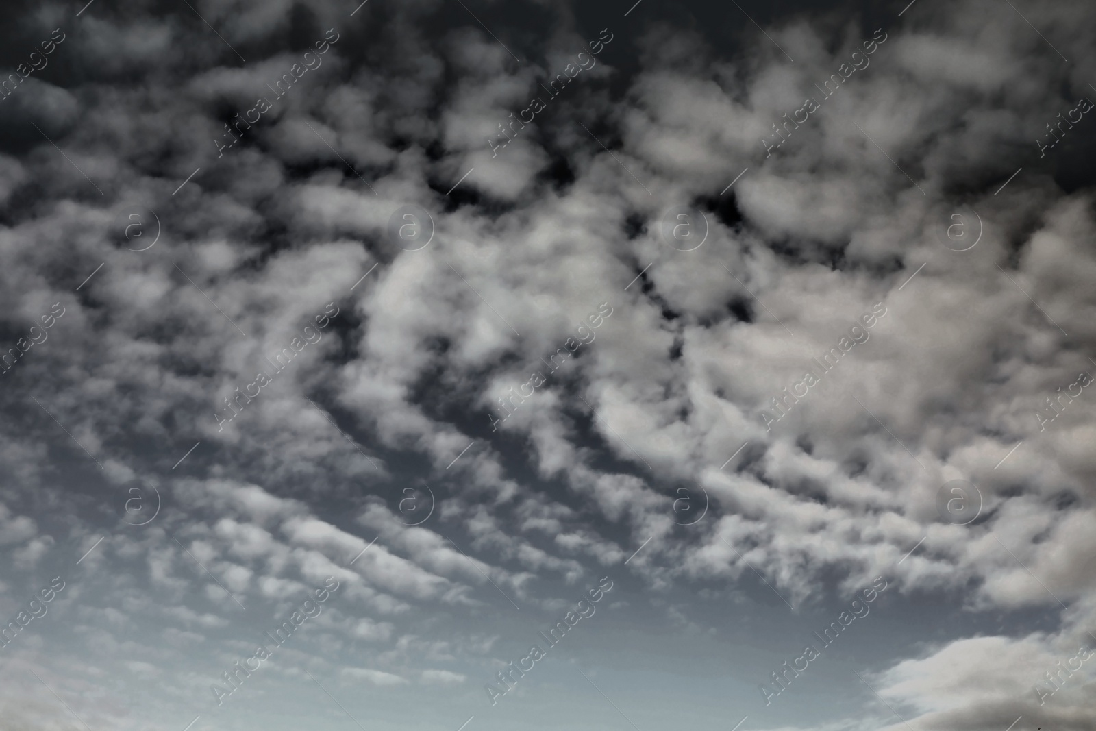 Image of Sky covered with rainy clouds. Stormy weather