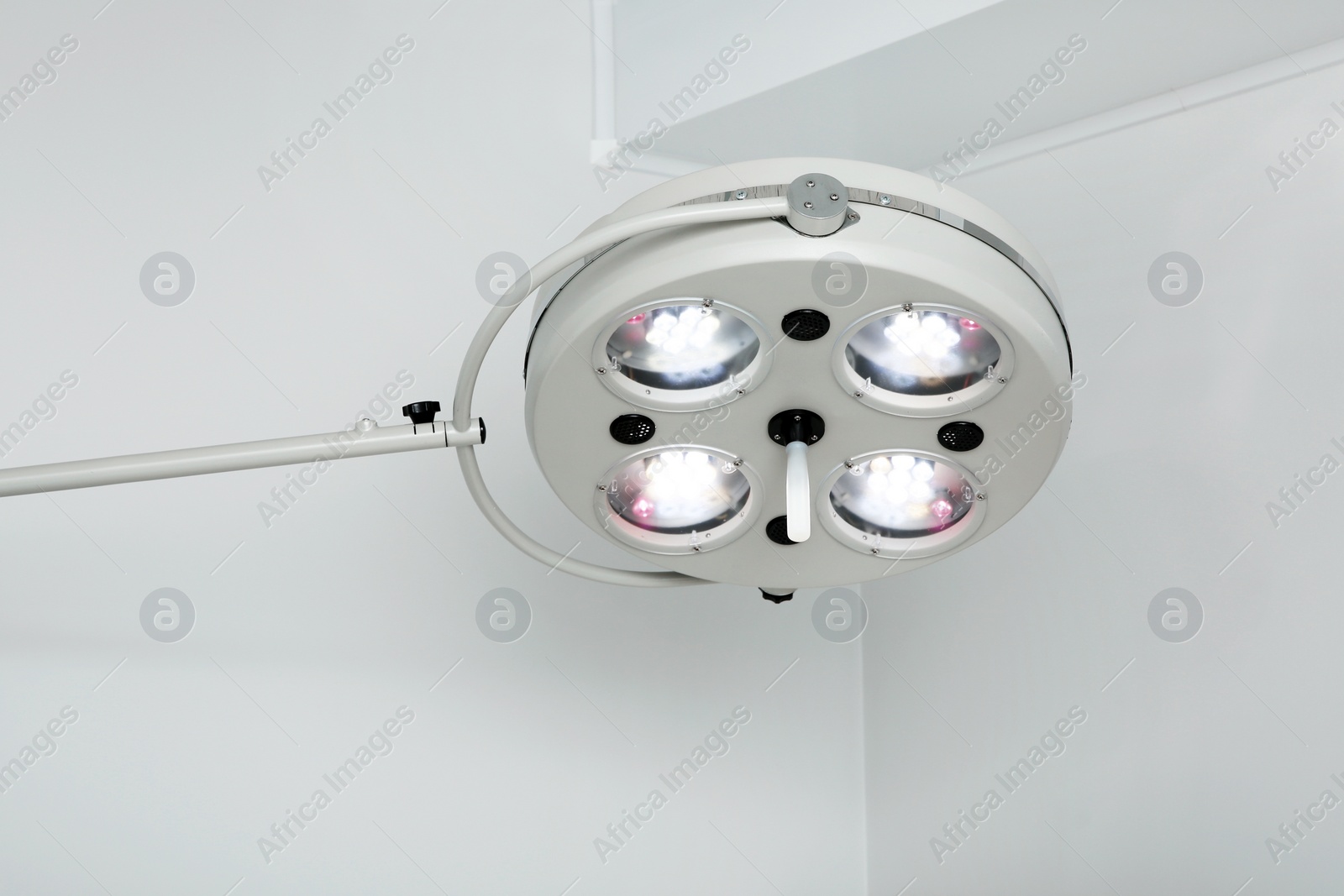 Photo of Powerful surgical lamps in modern operating room