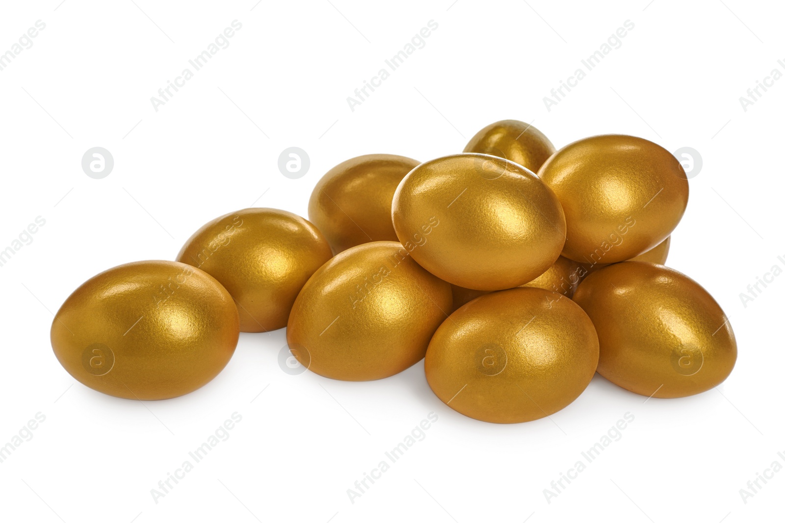 Photo of Many shiny golden eggs on white background