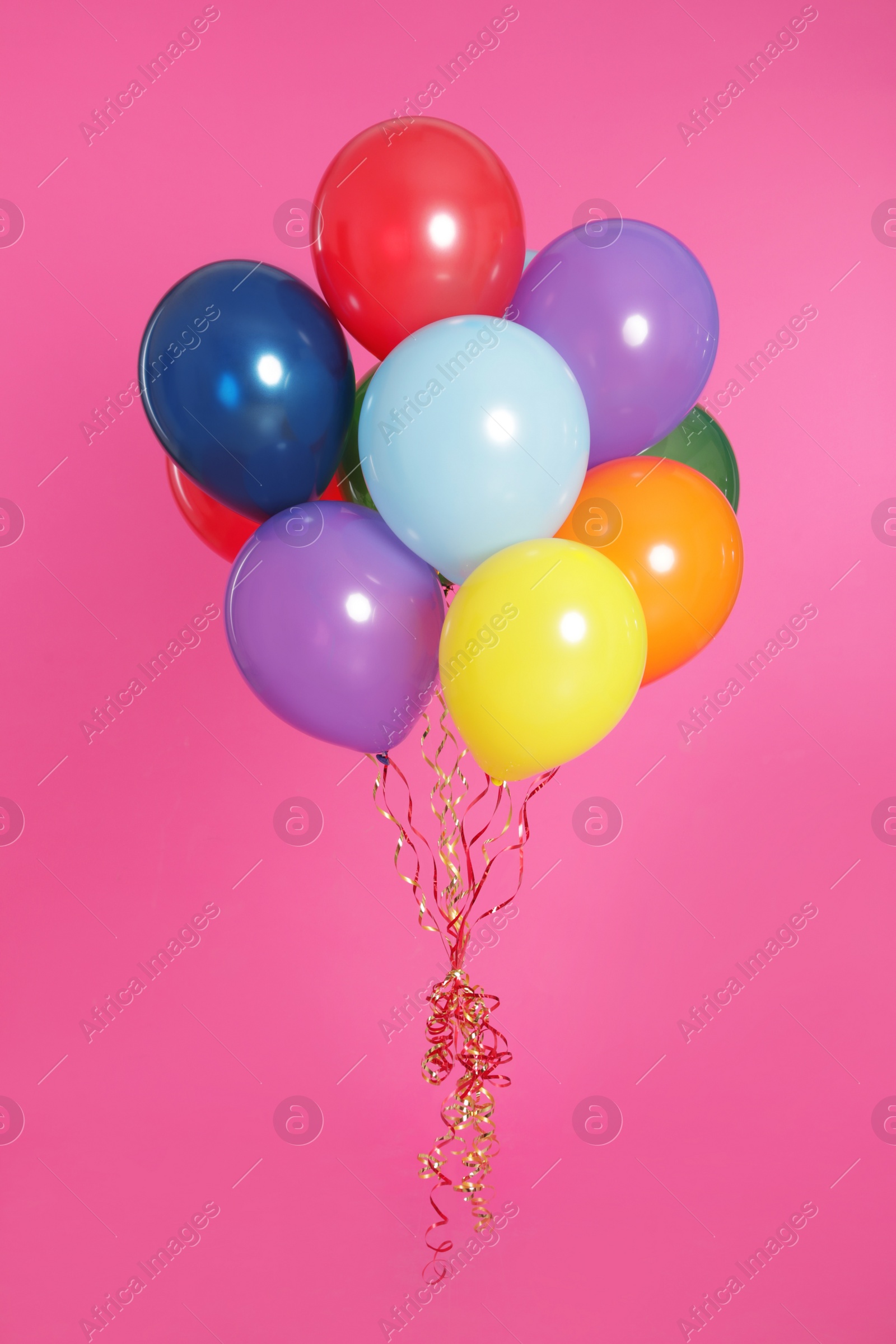 Photo of Bunch of bright balloons on color background