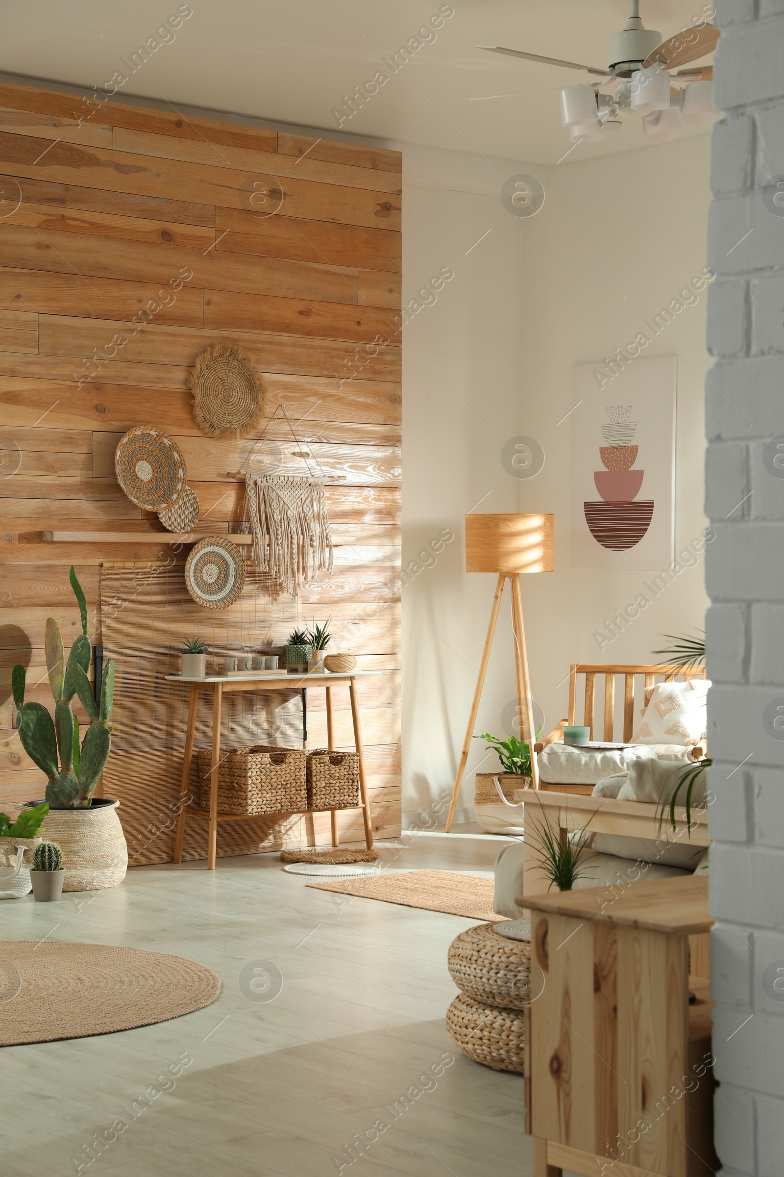 Photo of Stylish living room interior with wooden furniture and beautiful houseplants