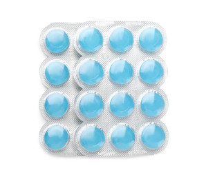Photo of Blisters with blue cough drops on white background, top view