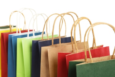 Colorful paper shopping bags on white background