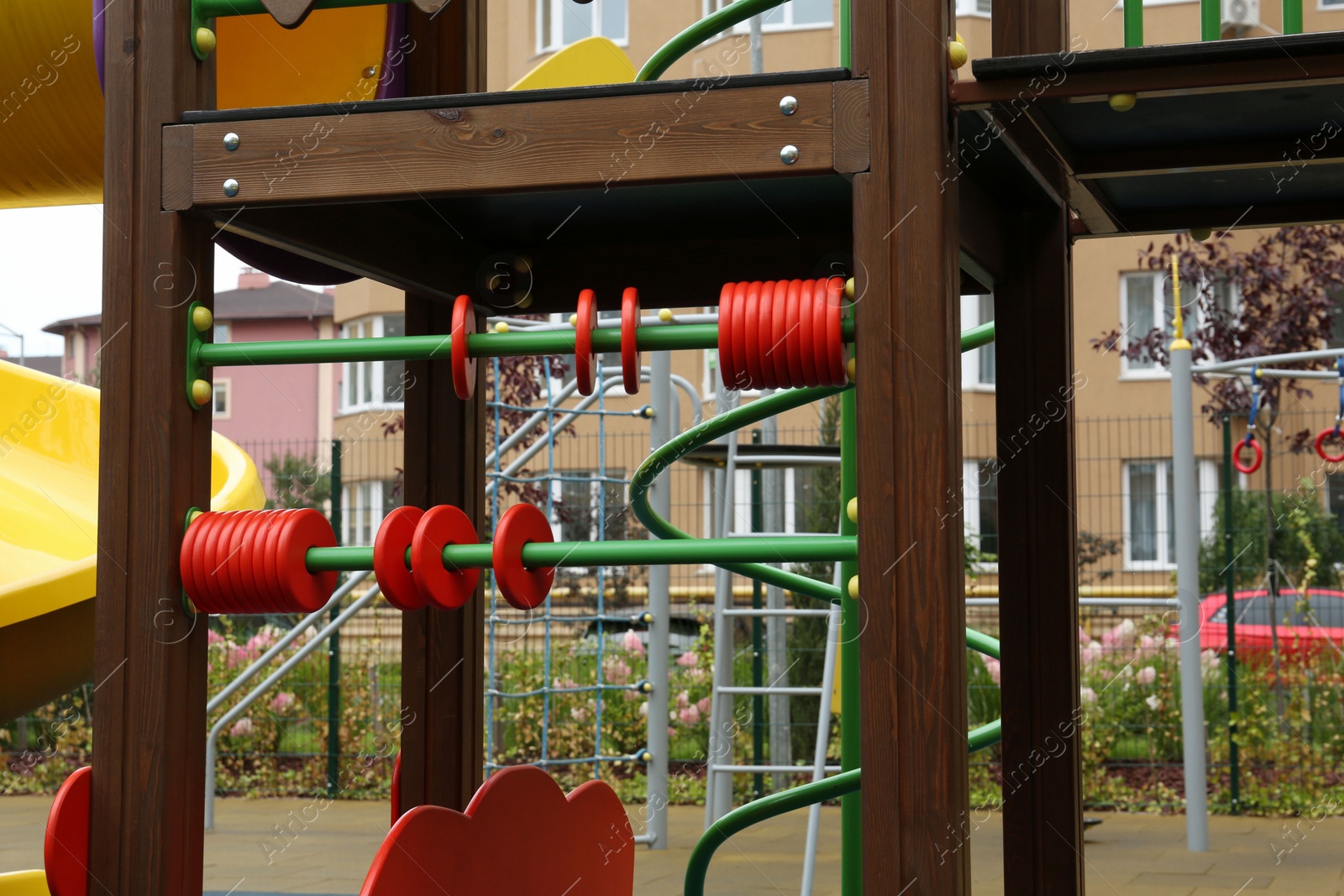 Photo of Colourful abacus on outdoor playground in residential area