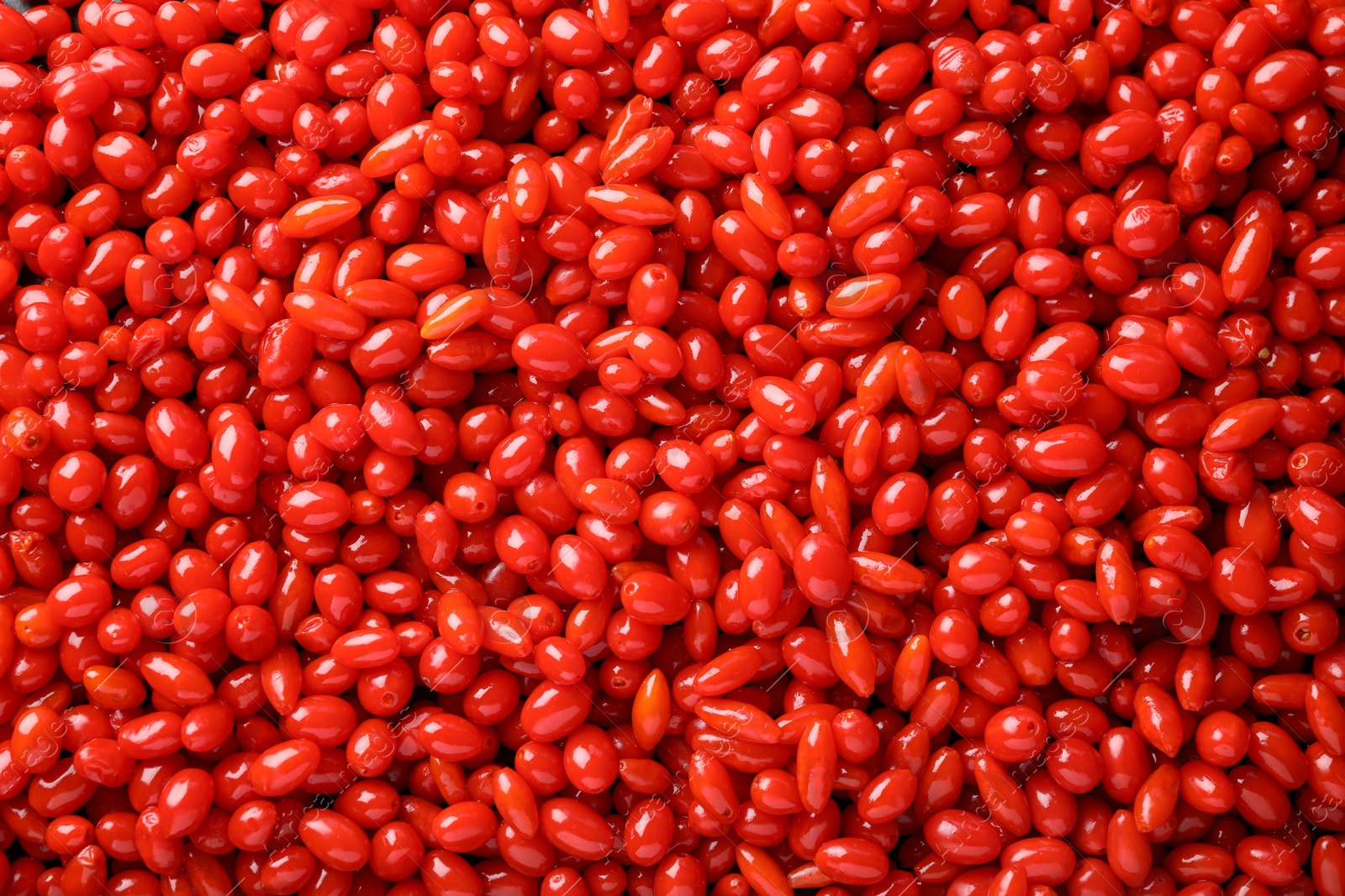 Photo of Fresh ripe goji berries as background, top view