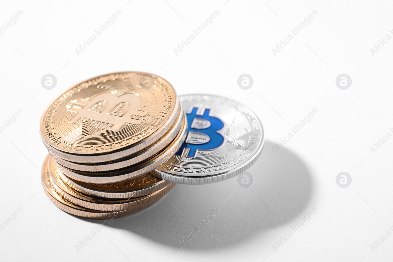 Photo of Stack of bitcoins on white background. Digital currency