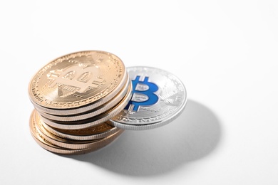 Photo of Stack of bitcoins on white background. Digital currency