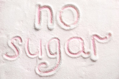 Phrase NO SUGAR written on sugar sand