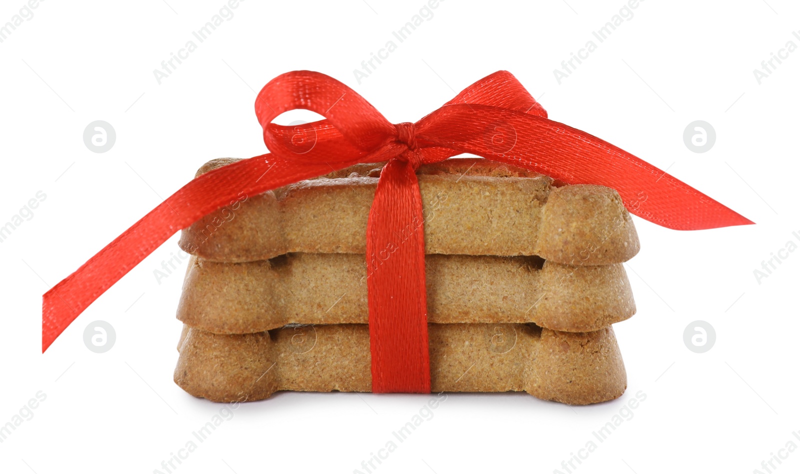 Photo of Bone shaped dog cookies with red bow isolated on white