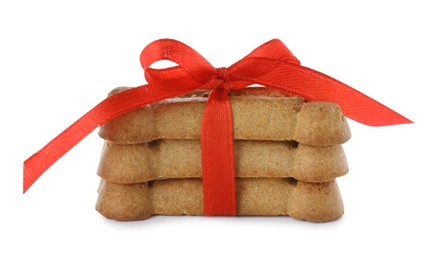 Photo of Bone shaped dog cookies with red bow isolated on white