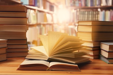 Image of Many books on wooden table in library