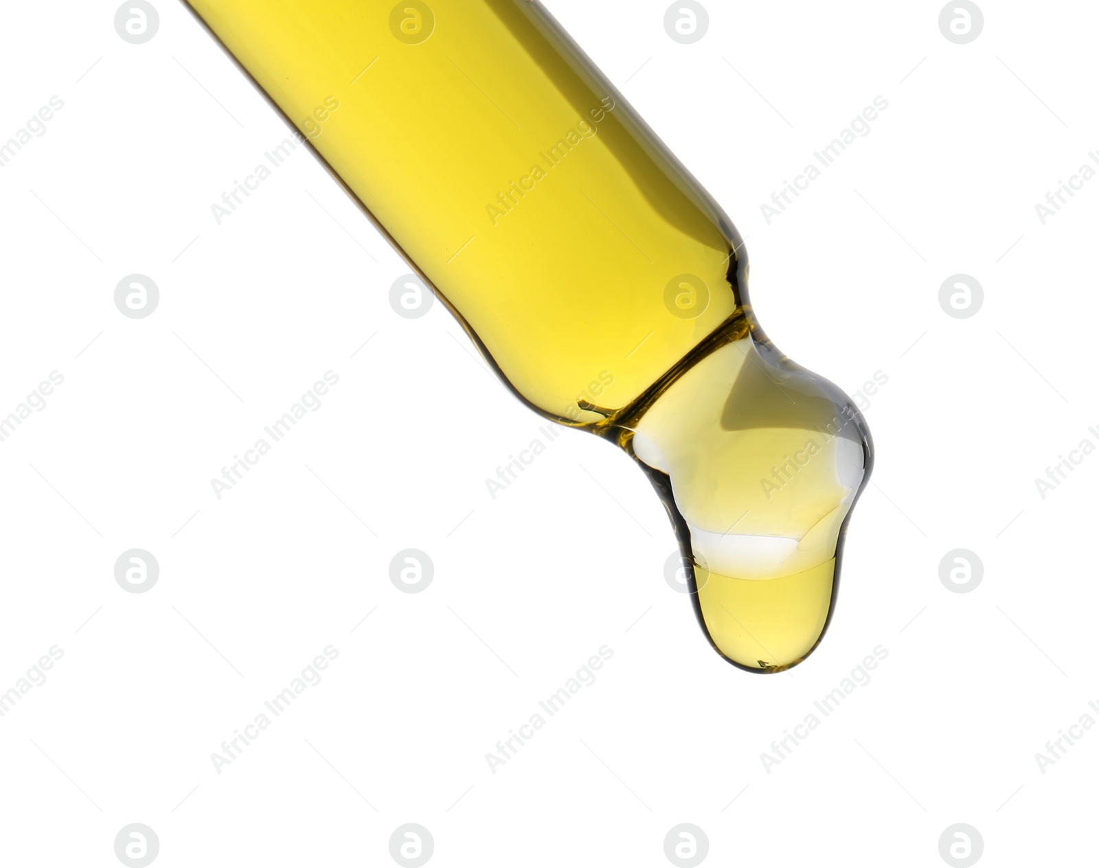 Photo of Dripping tincture from pipette isolated on white