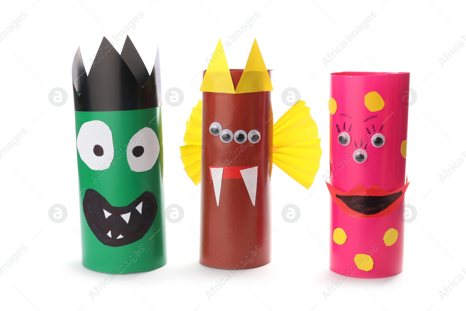 Photo of Funny monsters on white background. Halloween decoration