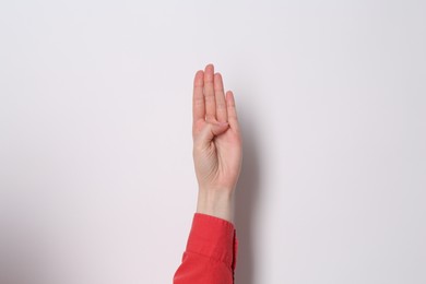 Photo of Woman showing open palm on white background, closeup