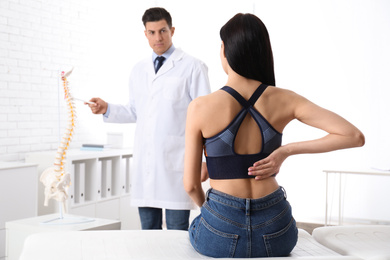 Photo of Young woman visiting orthopedist in medical office