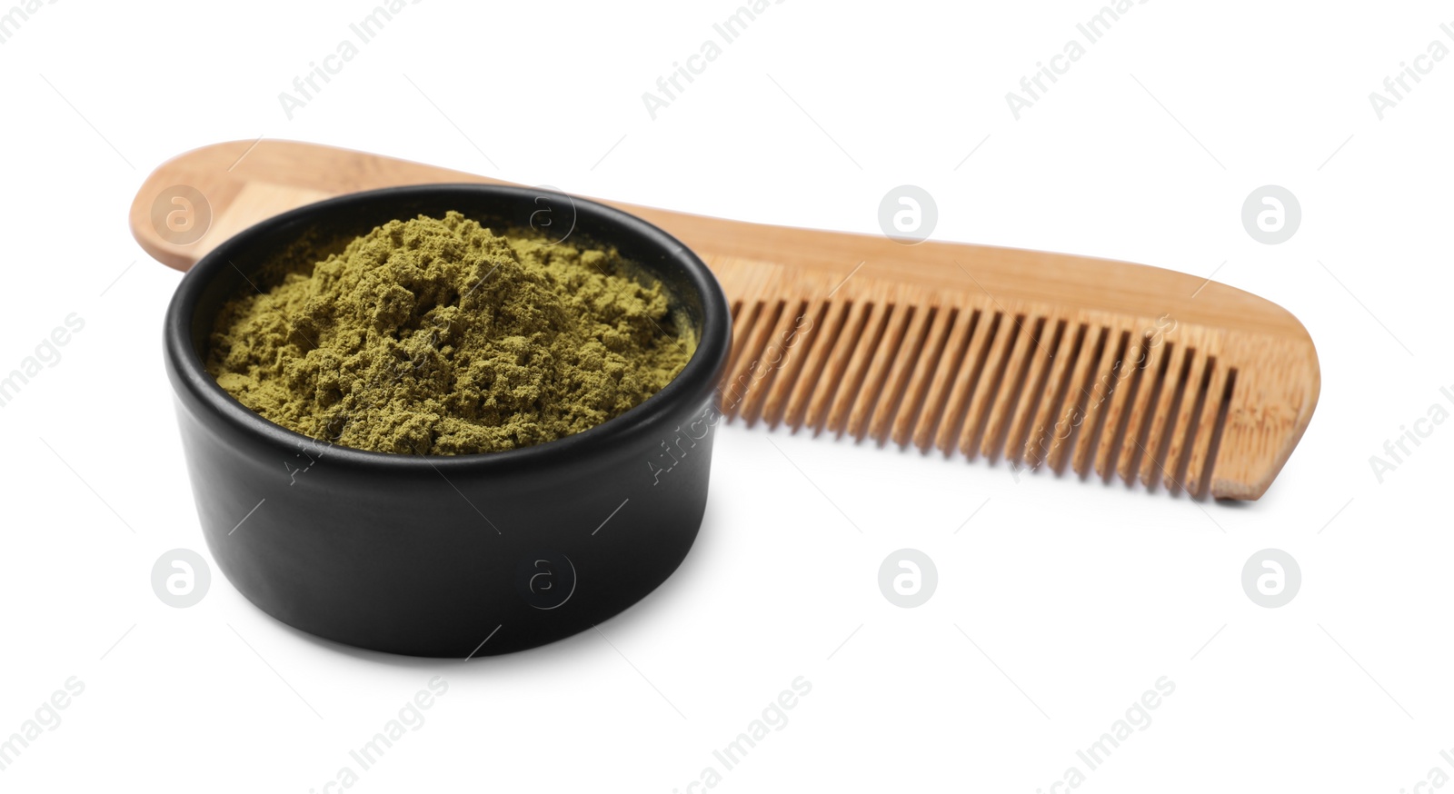 Photo of Henna powder in bowl and comb isolated on white