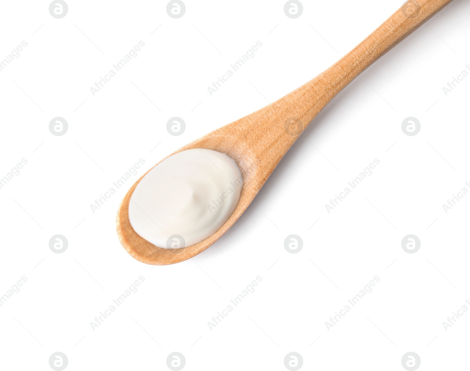 Photo of Wooden spoon with sour cream on white background