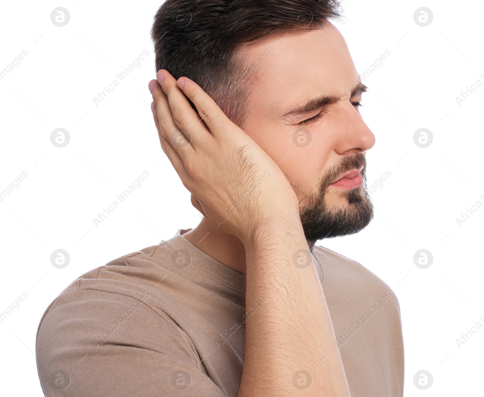 Photo of Young man suffering from ear pain on white background