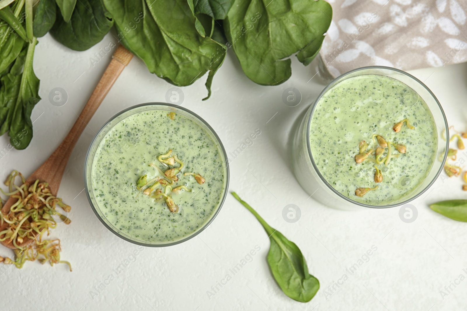 Photo of Flat lay composition with green buckwheat smoothie 
on white table