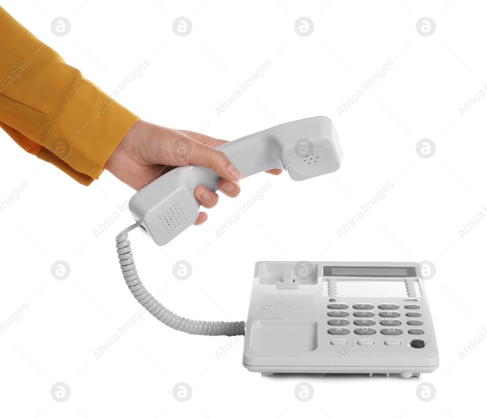 Photo of Young woman picking up telephone on white background